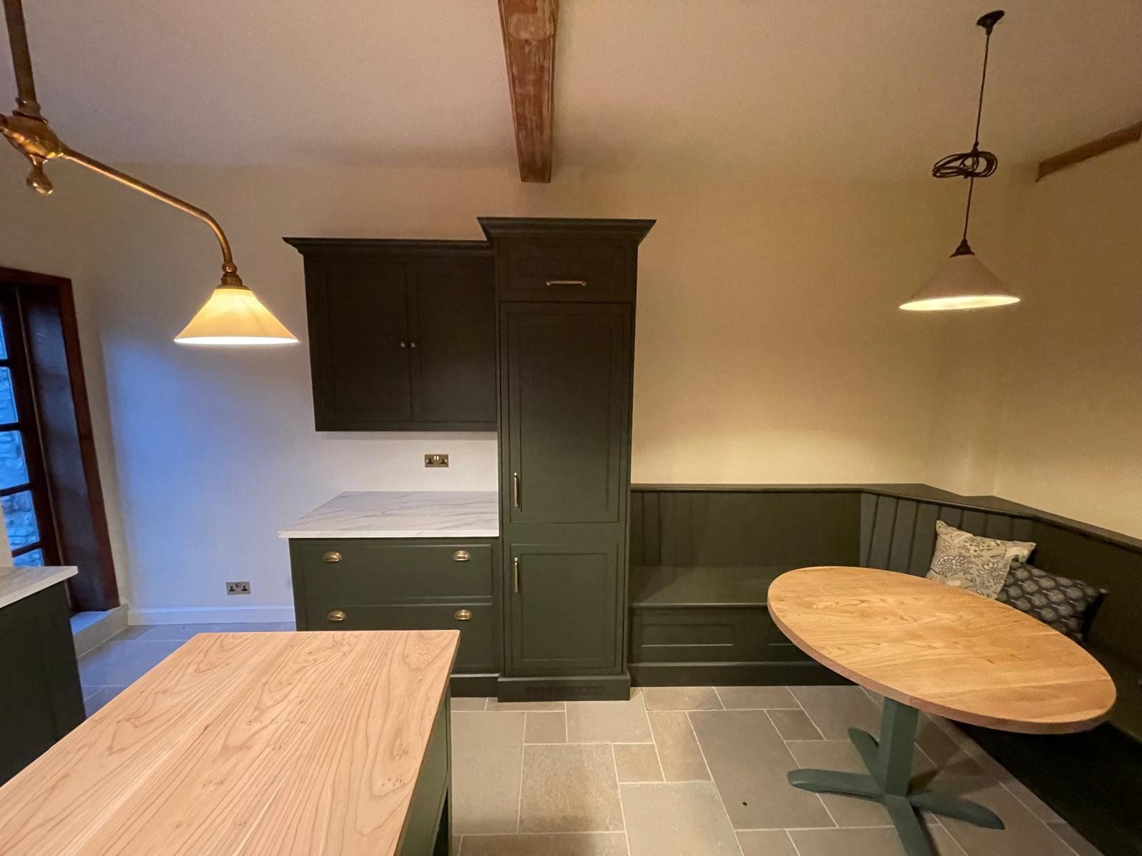 Built-in banquette dining bench around an oak table