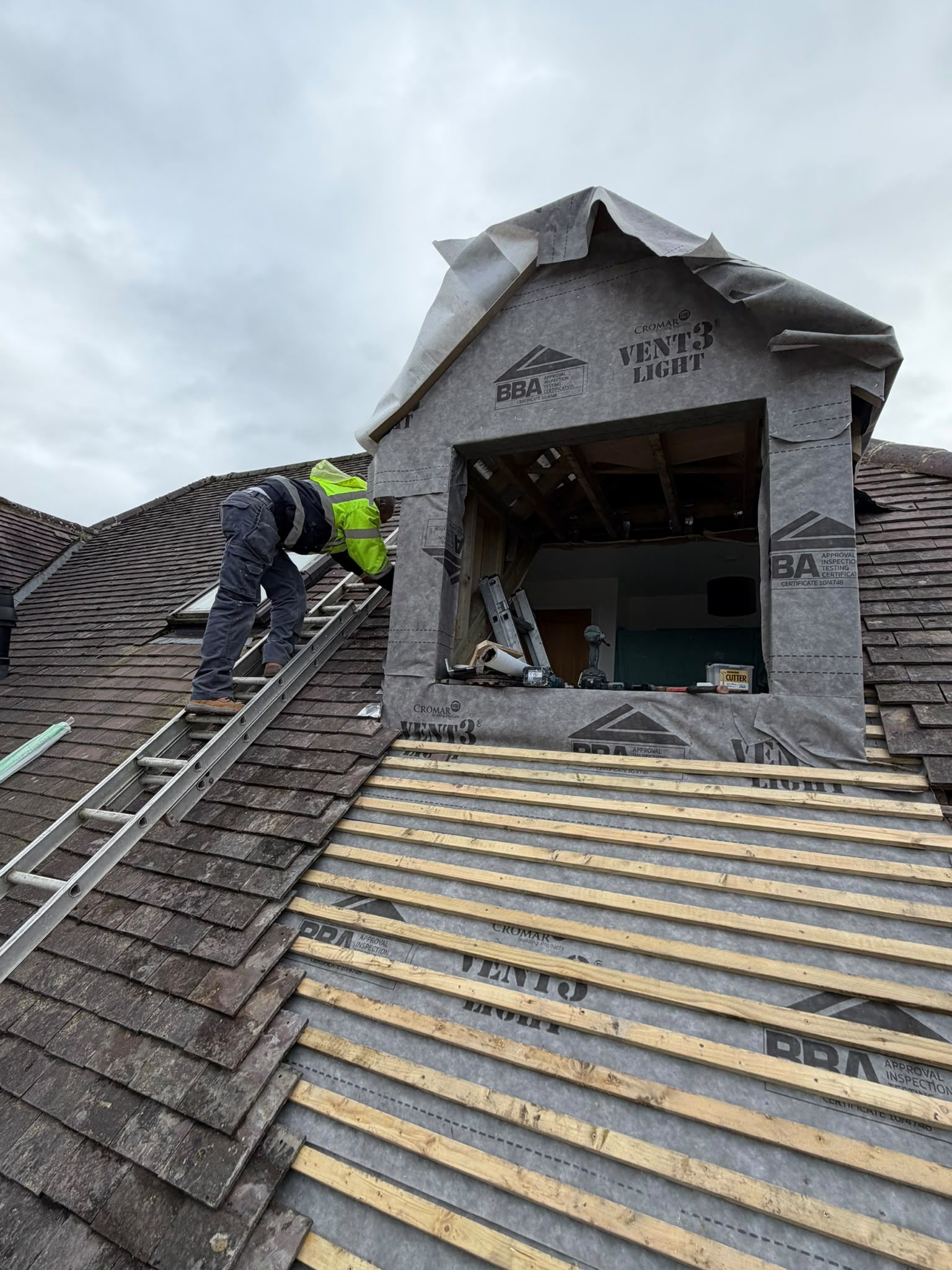 New dormer wrapped in breathable membrane, with the roof battened around it