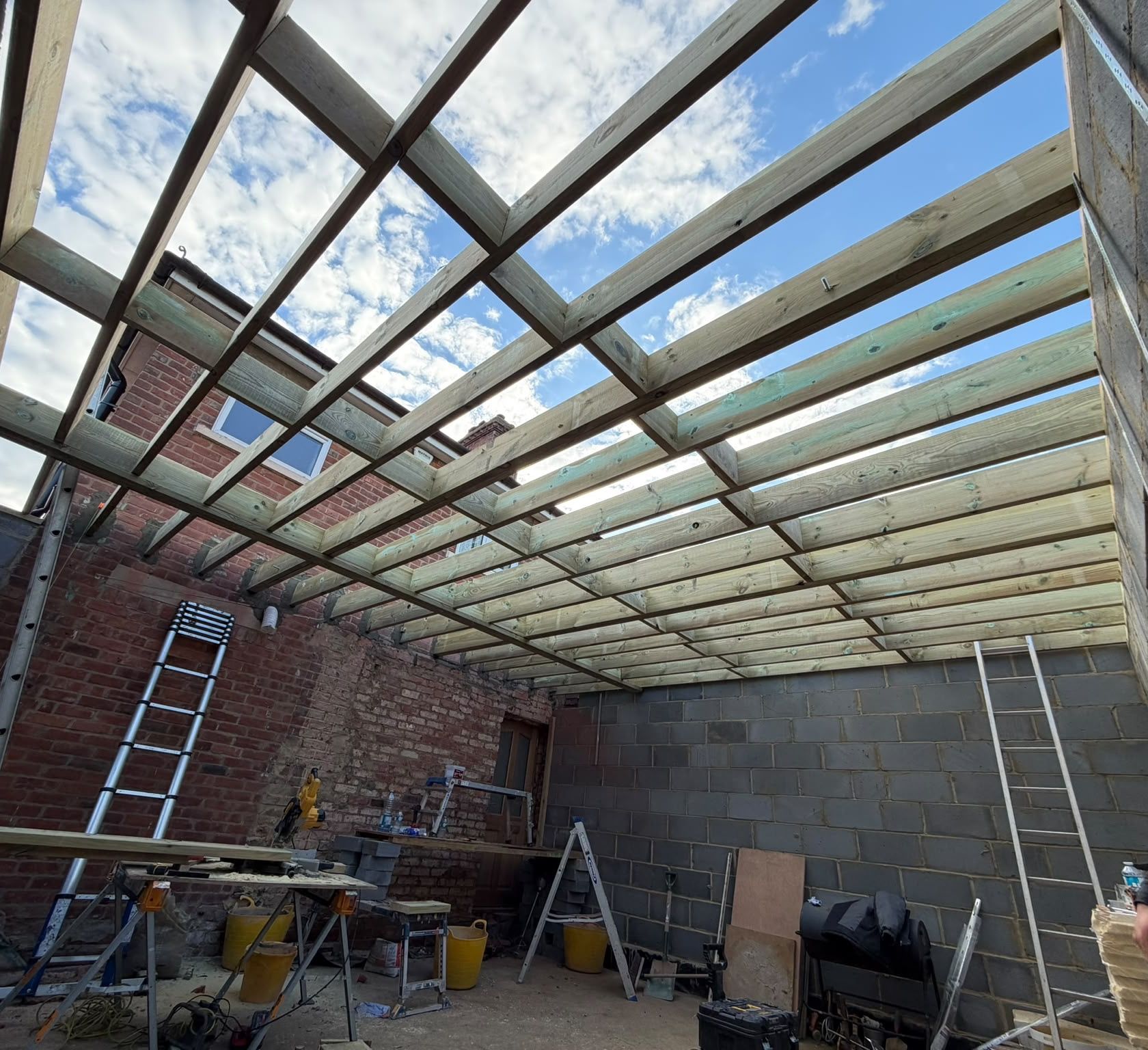 Blockwork walls and roof joists of a rear extension going up