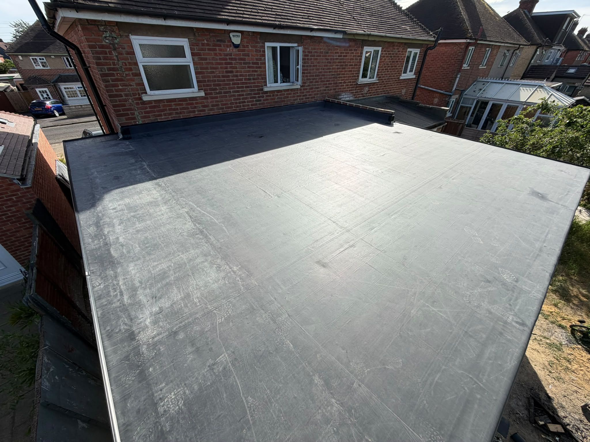 Newly finished EPDM flat roof on an extension