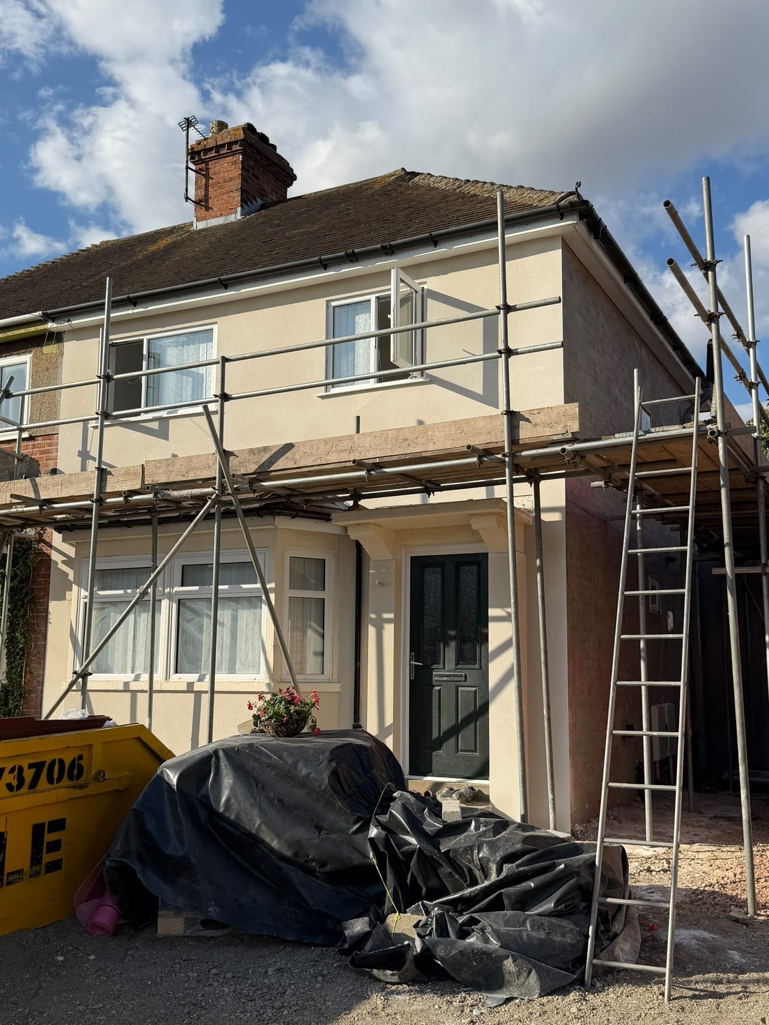 House extension exterior during work, with scaffolding in place