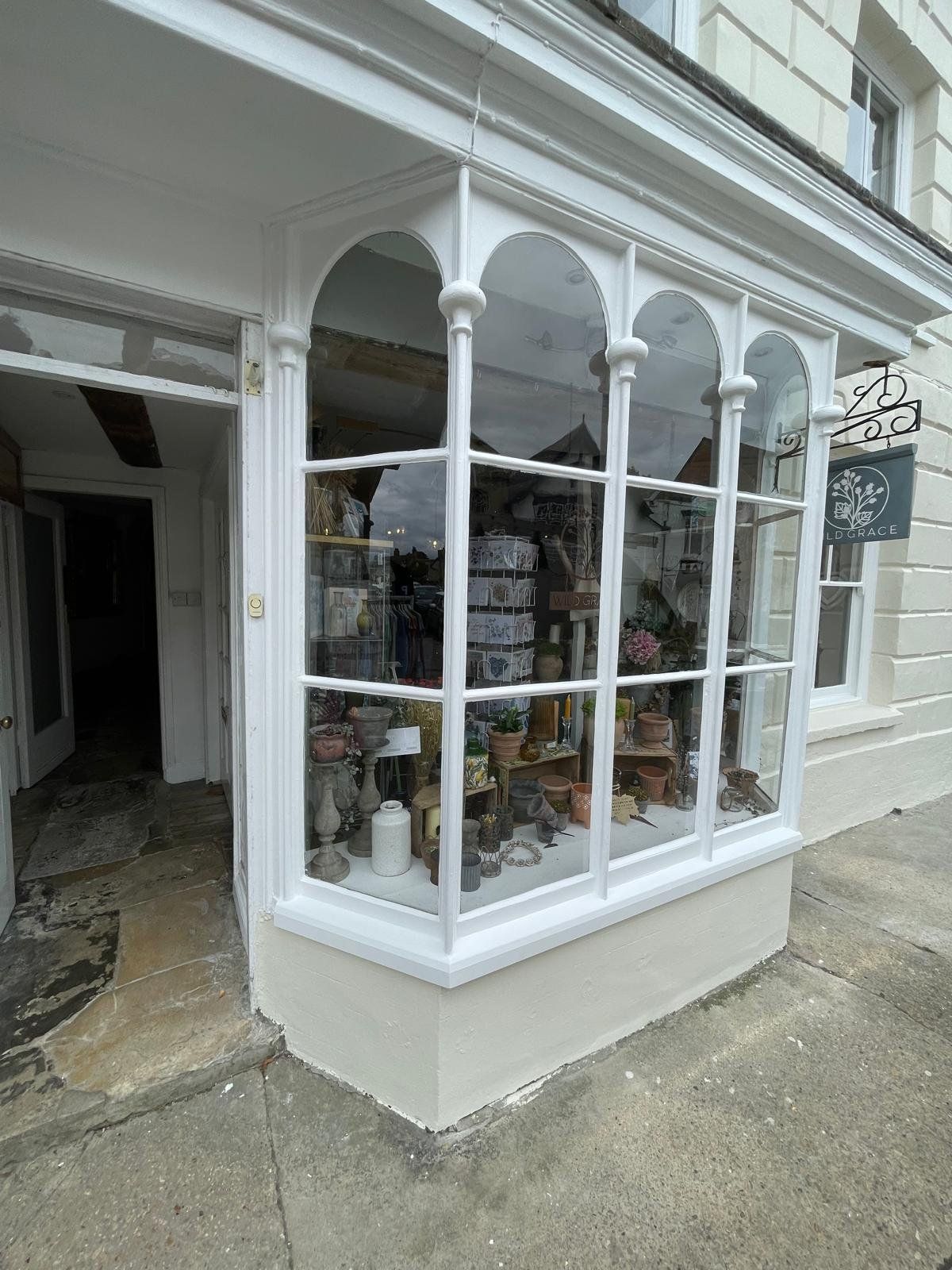 Restored timber bay window on a historic shopfront