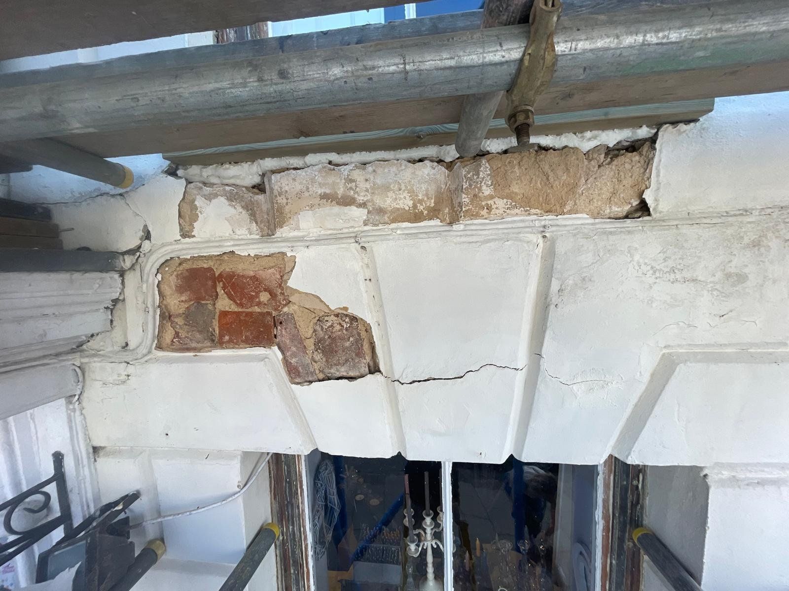 Scaffolded stone facade repair on a period house
