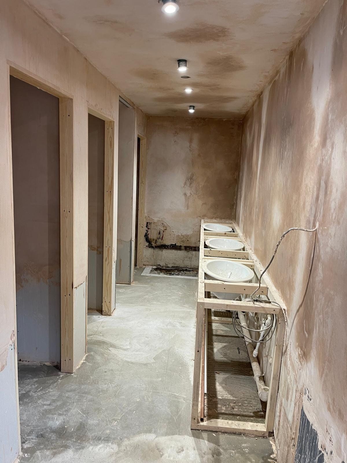 Plumbing first fix in a stripped room