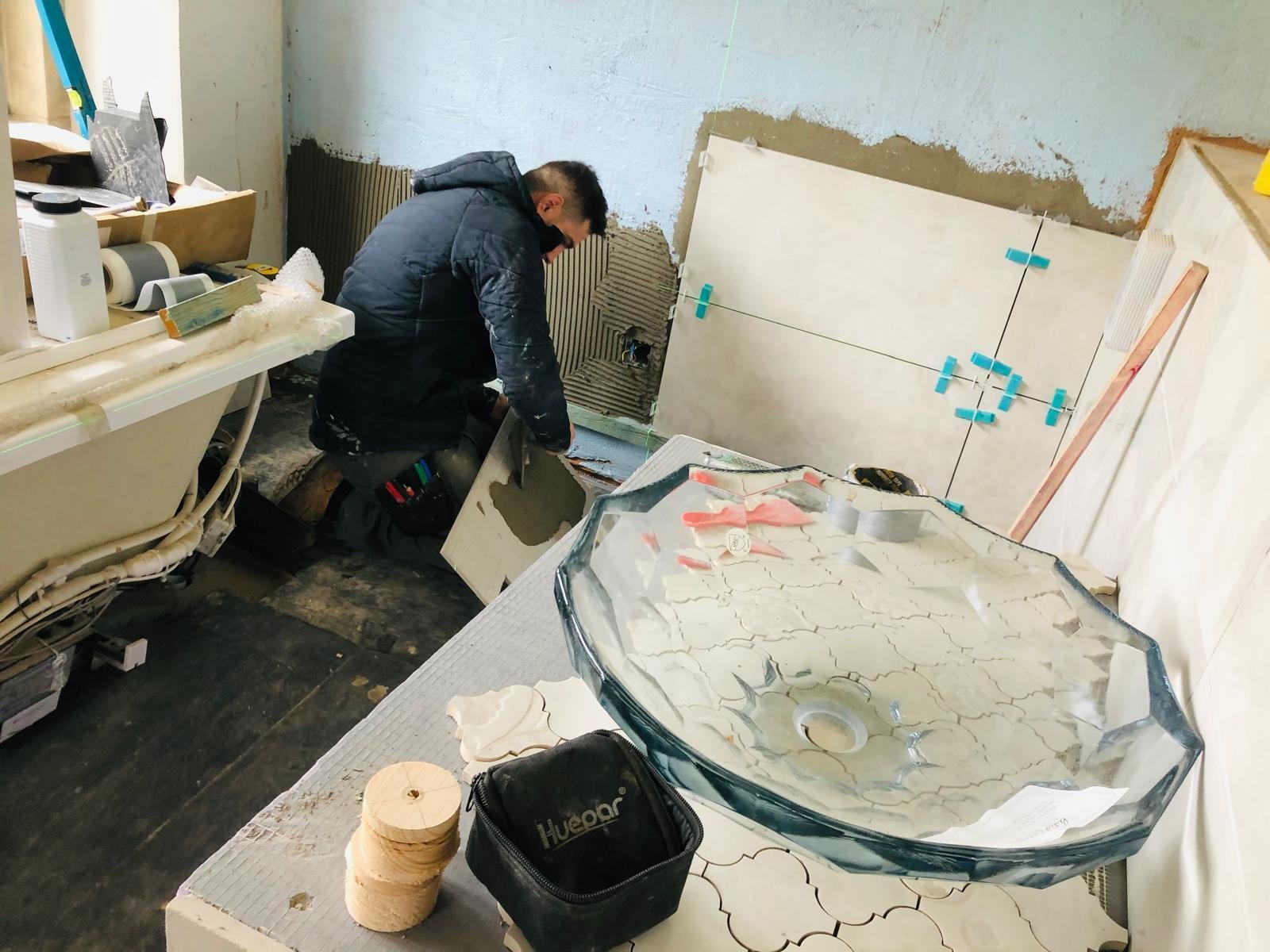 Oxford Direct Builders craftsman fitting a custom designer shower tray