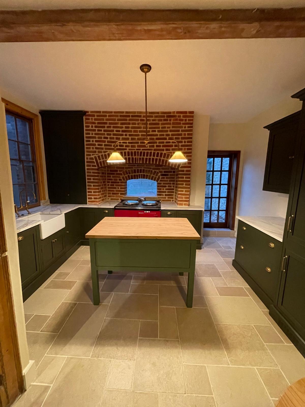 Handcrafted shaker kitchen with central island and brick arch feature in Oxford