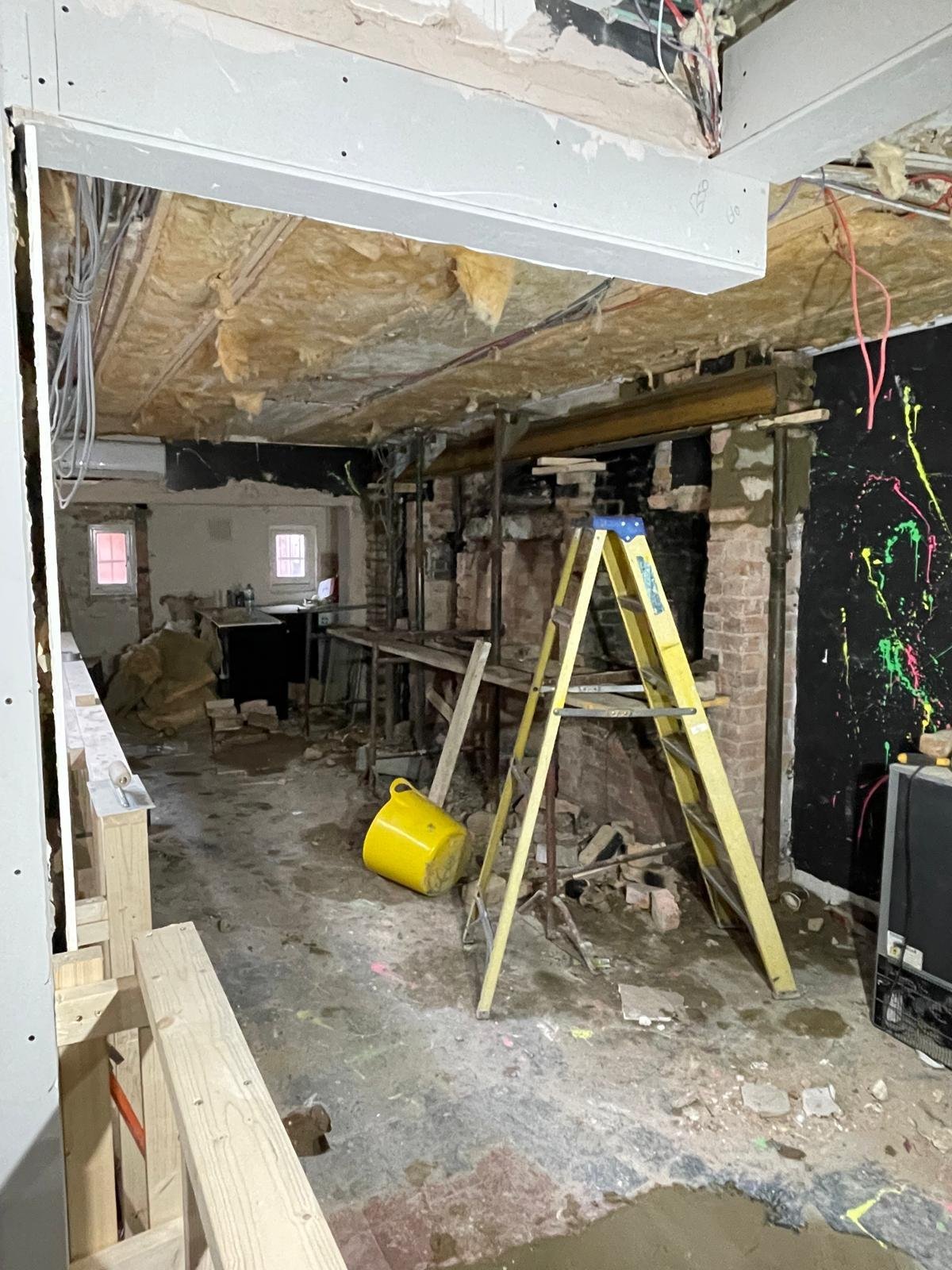 Structural beam support and exposed brickwork during renovation in Oxford