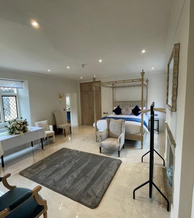 Luxury master bedroom refurbishment with four-poster bed completed by Oxford Direct Builders in Oxfordshire